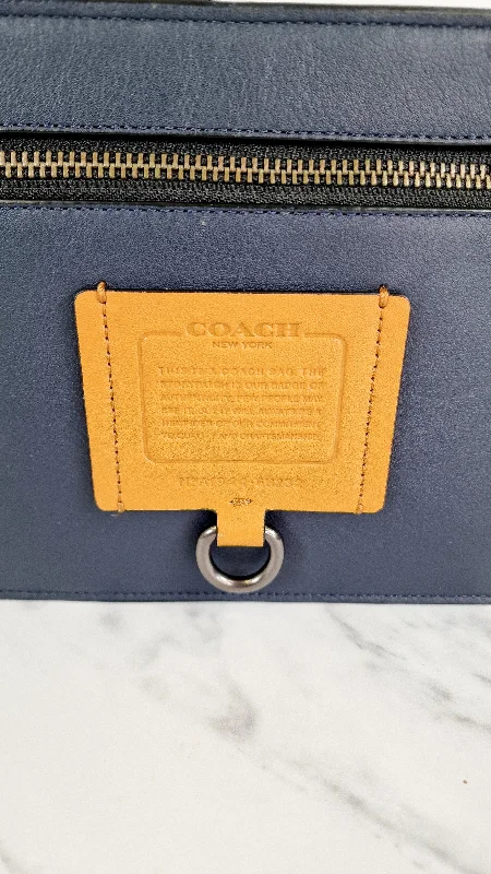 Customizable monogram bagsCoach Rivington Convetible Pouch Clutch in Navy Blue Smooth Leather with Yellow Details - Coach 68232